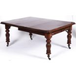 A Victorian mahogany single leaf extending dining table, the rounded rectangular top with moulded