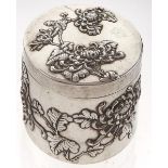 A Chinese silver repousse round box and cover, c1900, crisply decorated with chrysanthemum flowers