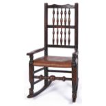 An early 19th c ash and elm Lancashire spindle back elbow chair, c1830, the back with two rows of