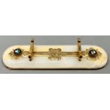 A Victorian gilt brass mounted onyx pen rest, c1880, set with two inlaid Ashford black marble floral