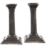 A pair of Victorian silver dwarf columnar candlesticks, on stepped square foot, nozzles, 15.5cm h,