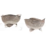 A pair of silver sweetmeat bowls, 20th c, with beaded rim, repousse band and shell feet, 10cm