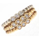 A Portuguese diamond ring, in gold, control mark for 18ct to each of the three hoops, 4g, size M