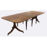 A George III mahogany twin pillar dining table, in the manner of Gillows, c1820, with drop leaf