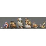 Six Royal Crown Derby paperweights, in the form of a linnet and other birds, printed marks, gilt