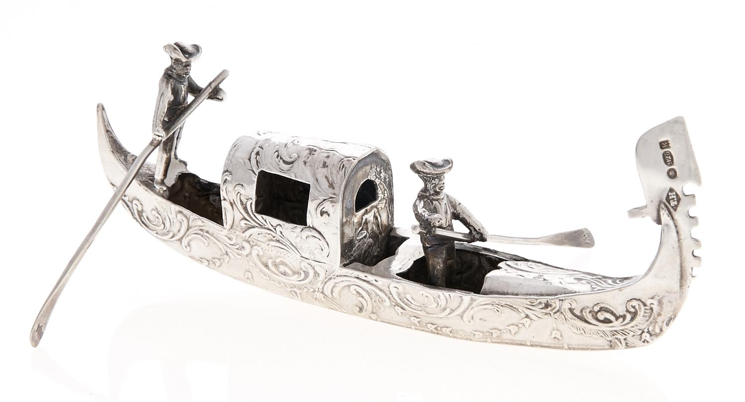 A German miniature silver model of a Venetian gondola and two gondoliers, 13.5cms l, bearing