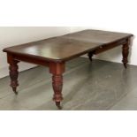 A Victorian mahogany dining table, on reeded bulbous legs and pottery castors, with leaves, 258cm