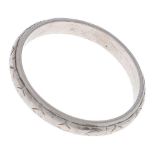 A platinum wedding ring, marked PLAT, 3.3g, size K Wear consistent with age