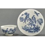 A Worcester blue and white tea bowl and saucer, c1780, transfer printed with the Birds in Branches