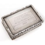 A Victorian silver snuff box, with waisted sides and chased rim, the lid engraved with