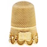 A gold thimble, circa late 19th c, 23mm, unmarked, 4.2g Good condition, not holed, minor dent in one