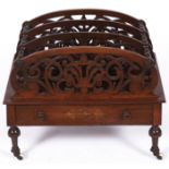A Victorian inlaid walnut three compartment Canterbury, the four arched panels fret carved with