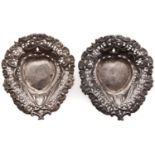 A pair of Victorian heart shaped die stamped and pierced silver pin trays, 90cm l, Chester 1897, 1oz