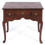 A George III oak and crossbanded lowboy, late 18th c, fitted with three drawers to the apron, on