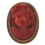A Victorian coral cameo brooch of the head of a bacchante, in gold, the glazed back with hair, 5.
