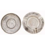 Two Chinese silver ashtrays, each inset with a contemporary dollar, early 20th c, 85mm diam and