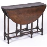 An oval oak gateleg table, the top with D-shaped folding leaves above a 'spider' gateleg base with
