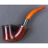 Smoking. A meerschaum tobacco pipe, c1900, plated mounts and amber mouthpiece, bowl 85mm l, plush