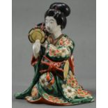 A Japanese Imari figure of a bijin with drums, 20th c, flat unglazed base, 19cm h Generally good