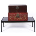 A  red lacquer Chinese trunk, decorated to the front with birds amidst stylised chrysanthemum