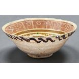 Islamic Ceramics.  A Nishapur pottery bowl, Iran, 10th c, decorated to the centre with a stylised