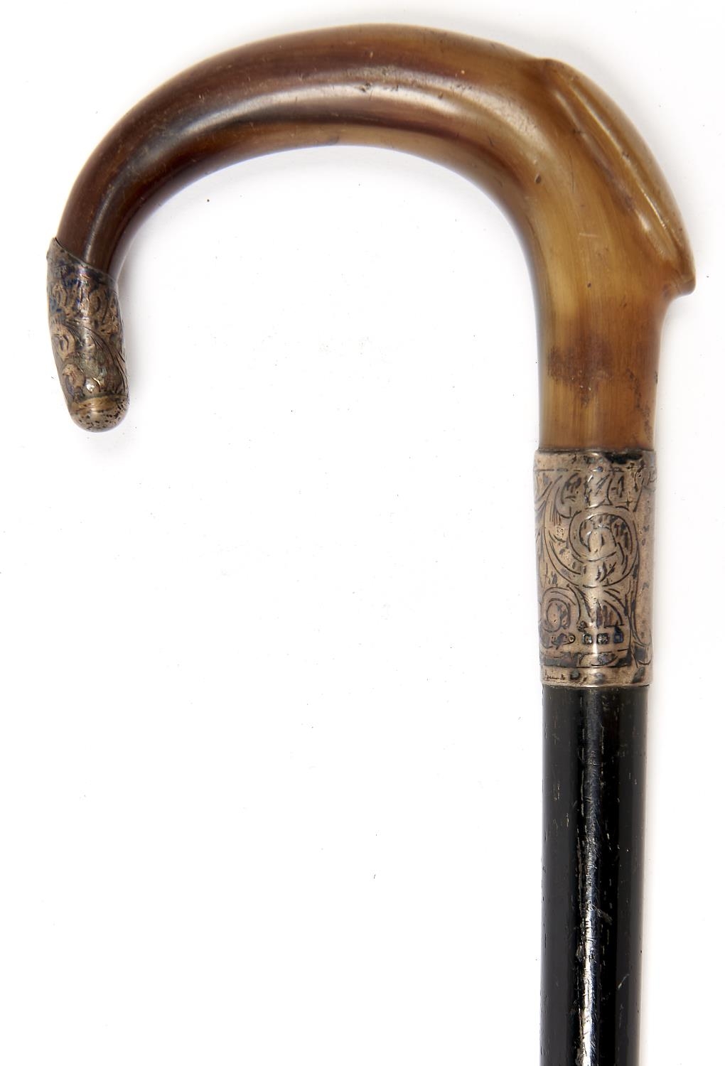 A silver mounted, horn handled, ebonised walking cane, early 20th c, brass tip, 91cm, hallmarked