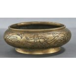 A Chinese bronze censer,  19th c, of compressed globular form with shallow rim, the body engraved