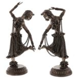 A pair of Indian plated metal statuettes of dancing girls, 20th c, 20.5cm h Bases dented around