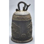 A Japanese bronze temple bell,  the top with zoomorphic suspension ring, the body with three