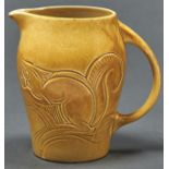 Susie Cooper. A yellow glazed earthenware squirrels jug, dated 1932, 15.5cm h, incised signature and