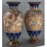 A pair of Doulton ware blue ground vases with chine gilt decoration, c1900, 29cm h, impressed