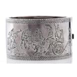 A Victorian silver bangle, c1880, engraved with a charioteer, unmarked
