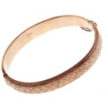 A 9ct gold bangle, Chester 1917, 12.4g Light dents on underside