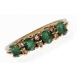 An emerald and white stone ring, in 9ct gold, 2.1g, size L Good condition