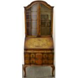 A  burr walnut  bureau bookcase in Queen Anne style,   c1930, the arched top enclosed by a pair of