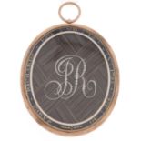 A gold mourning locket, 1795, the glazed obverse with seed pearl initials JR over plaited hair in