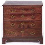 A George III mahogany chest of drawers, late 18th c, the moulded top with re-entrant corners, fitted
