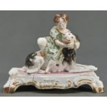 A Staffordshire bone china figure of a child with a spaniel, c1830, on oblong pink and gilt base,