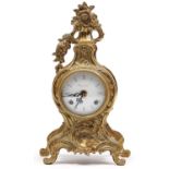 An Italian gilt brass mantel clock, 20th c, in rococo style, the enamel dial inscribed Imperial