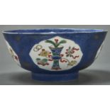 A Chinese powder blue ground famille verte bowl, Qing dynasty, 18th c, 18.5cm diam, underglaze