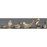 Six Royal Crown Derby paperweights, in the form of a brown pelican and other birds, printed marks,