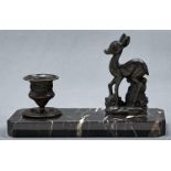 An Art Deco style candle stand, the cantered rectangular striated black marble base fitted bronzed