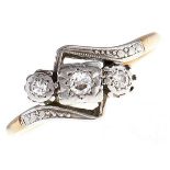 A three stone diamond ring, in gold marked 18ct PLAT, 2.7g, size P Wear consistent with age, claws