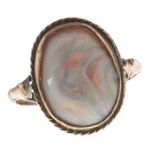 A black opal ring, in gold marked 9c, 2.6g, size N Opal genuine but heavily abraded, ring worn and