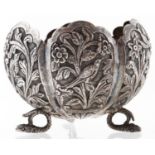 An Indian flower shaped silver repousse sugar bowl, late 19th c, on three snake feet, 65mm h, 2ozs