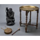 An Eastern brass tray on folding wood stand, early 20th c, 40cm diam, a contemporary brass wall