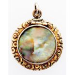 A Victorian gold locket, later set with snail shell, 19th c, chased surround, 6.1g Good condition