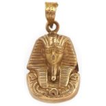 An Egyptian gold Tutankhamun mask pendant, 2.5g Wear and dent on the reverse