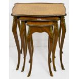 A nest of three kingwood and mahogany tables, 20th c, in Louis XV style, with cube parquetry top and