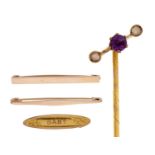 A gold stick pin with amethyst and split pearl terminal, c1900, terminal 12mm, marked 9c, a gold